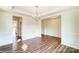 Spacious dining area boasts elegant wainscoting, trey ceiling, and stylish chandelier at 2012 Embassy Ct # 46, Charlotte, NC 28213