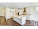 Spacious kitchen with white cabinets, stainless steel appliances, and a large center island at 2012 Embassy Ct # 46, Charlotte, NC 28213