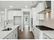 Well-lit kitchen boasts stainless steel appliances, white cabinetry, and a center island at 2012 Embassy Ct # 46, Charlotte, NC 28213