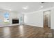Spacious living room featuring a fireplace, hardwood floors, and plenty of natural light at 2012 Embassy Ct # 46, Charlotte, NC 28213