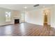 Bright living room featuring a cozy fireplace, sleek hard floors, and light-filled windows at 2012 Embassy Ct # 46, Charlotte, NC 28213