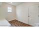 Mud room with a white back door, wood floors, and one window at 2012 Embassy Ct # 46, Charlotte, NC 28213
