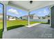 This home features a covered patio and expansive backyard views at 2012 Embassy Ct # 46, Charlotte, NC 28213