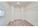 Spacious walk-in closet with shelving for optimal storage at 2012 Embassy Ct # 46, Charlotte, NC 28213