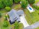 Aerial view of a home, pool, and green surroundings, perfect for outdoor living at 206 Montclair Dr, Locust, NC 28097