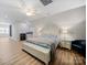 Spacious bedroom with a ceiling fan, laminate flooring, and natural light at 206 Montclair Dr, Locust, NC 28097