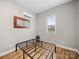 Minimalist bedroom with hardwood floors, a new window and mini-split unit at 206 Montclair Dr, Locust, NC 28097