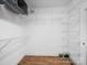 Walk-in closet with white shelving and hardwood floors at 206 Montclair Dr, Locust, NC 28097