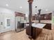 Bright kitchen with wooden cabinets, stainless steel appliances, and white countertops at 206 Montclair Dr, Locust, NC 28097
