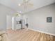 A minimalist kitchenette with a sink, cabinets, and a stainless steel refrigerator at 206 Montclair Dr, Locust, NC 28097