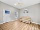 Comfortable living space featuring laminate floors, a window, and a light colored sofa at 206 Montclair Dr, Locust, NC 28097