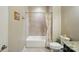 Bathroom featuring granite vanity, tiled shower with curtain, and updated fixtures at 2119 Augusta National Dr, Denver, NC 28037