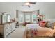 Sun-filled bedroom with bay window, light gray walls, neutral carpet, and modern decor at 2119 Augusta National Dr, Denver, NC 28037
