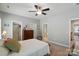 Bedroom with ensuite bathroom, neutral walls and carpet, and a ceiling fan at 2119 Augusta National Dr, Denver, NC 28037