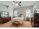 Bedroom filled with natural light, a comfortable bed, and charming decor at 2119 Augusta National Dr, Denver, NC 28037