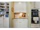 Butler's pantry featuring custom cabinets, granite countertops, and stainless steel appliances at 2119 Augusta National Dr, Denver, NC 28037