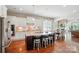 Spacious kitchen with a large island, stainless steel appliances, and hardwood floors at 2119 Augusta National Dr, Denver, NC 28037