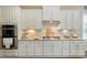 Updated kitchen with white cabinets, stainless steel appliances, and granite countertops at 2119 Augusta National Dr, Denver, NC 28037
