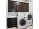 Laundry room featuring cabinets, sink, and modern Samsung washer and dryer at 2119 Augusta National Dr, Denver, NC 28037