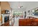 Spacious living room with fireplace, hardwood floors, and an open layout at 2119 Augusta National Dr, Denver, NC 28037