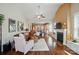 Bright, open living room with fireplace, hardwood floors, and access to other rooms at 2119 Augusta National Dr, Denver, NC 28037