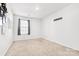 Neutral bedroom with carpet, blank white walls, one window, and space for customization at 2120 Redstone Dr, York, SC 29745