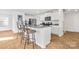 Modern kitchen featuring stainless steel appliances, granite countertops, white cabinets, and barstool seating at 2120 Redstone Dr, York, SC 29745