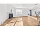 Bright, open living room featuring a fireplace, sliding glass doors, wood floors, and plenty of natural light at 2120 Redstone Dr, York, SC 29745