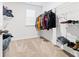 Walk-in closet with clothes and hanging rack, providing ample storage space at 2120 Redstone Dr, York, SC 29745
