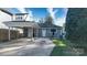 Detached carport and backyard of a gray home on a sunny day with blue sky and trees at 2124 Roslyn Ave, Charlotte, NC 28208