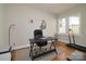 Functional home office setup with natural light and a treadmill at 2124 Roslyn Ave, Charlotte, NC 28208