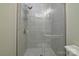 Modern shower showcasing sleek tile work and updated fixtures at 2124 Roslyn Ave, Charlotte, NC 28208