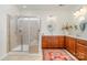 Neutral bathroom featuring tiled floors, a glass shower, and wood cabinets at 2158 Winhall Rd, Fort Mill, SC 29715