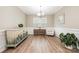 Neutral dining room featuring wood floors, wainscoting and stylish decor at 2158 Winhall Rd, Fort Mill, SC 29715