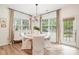 Cozy dining area with wood floors, stylish light fixture, and lots of natural light at 2158 Winhall Rd, Fort Mill, SC 29715