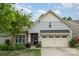 Charming home featuring light blue siding, a two car garage, and a well manicured front yard at 2158 Winhall Rd, Fort Mill, SC 29715