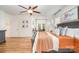 Comfortable main bedroom with ceiling fan, a view of the backyard, and an attached office area at 2158 Winhall Rd, Fort Mill, SC 29715