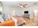 The main bedroom features warm colors, wood flooring, and comfortable furniture at 2158 Winhall Rd, Fort Mill, SC 29715