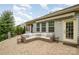 Cozy patio with brick floors and a comfortable outdoor sofa for relaxing and entertaining at 2158 Winhall Rd, Fort Mill, SC 29715