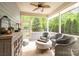 Relaxing screened porch with comfortable wicker furniture and a view of the backyard at 2158 Winhall Rd, Fort Mill, SC 29715