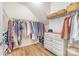 Spacious walk-in closet with ample storage, wood floors, and a dresser at 2158 Winhall Rd, Fort Mill, SC 29715