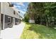 Backyard featuring a patio, shed, and lush greenery, perfect for outdoor relaxation and entertaining at 221 Belton Ave, Mount Holly, NC 28120