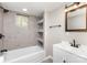 Recently updated bathroom with tiled walls, shower and bath combination, and modern vanity at 221 Belton Ave, Mount Holly, NC 28120