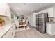 Open kitchen view showing stainless steel appliances and sightlines into the dining and living spaces at 221 Belton Ave, Mount Holly, NC 28120