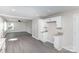 Spacious kitchen area with gray floors, white cabinetry, and granite countertops at 221 Belton Ave, Mount Holly, NC 28120