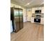 Updated kitchen with stainless steel appliances, granite counters, and plenty of storage space at 221 Belton Ave, Mount Holly, NC 28120