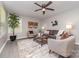 Nicely staged living room featuring modern furniture, neutral tones, hardwood floors, and lots of natural light at 221 Belton Ave, Mount Holly, NC 28120