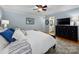 Relaxing bedroom with soft blue walls, plush bedding, and hardwood floors at 2382 Erika Ln, Gastonia, NC 28056