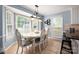 Charming breakfast nook featuring natural light, patterned chair upholstery and tile flooring at 2382 Erika Ln, Gastonia, NC 28056