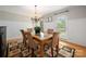 Cozy dining room features natural light from the windows and a decorative rug under the dining table at 2382 Erika Ln, Gastonia, NC 28056